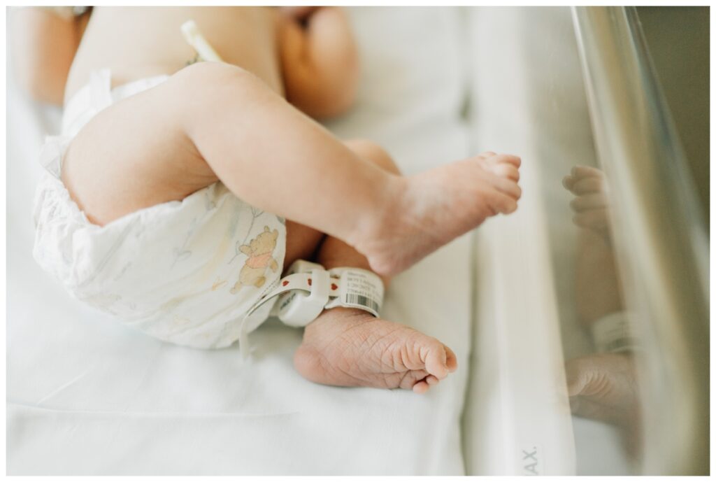 pictures of newborn baby's feet in hospital bassinet in photos from fresh 48 