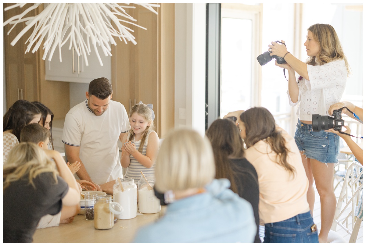 Family baking cookies in kitchen for family photography workshop and retreat Guiding Light with Haley Kinzie