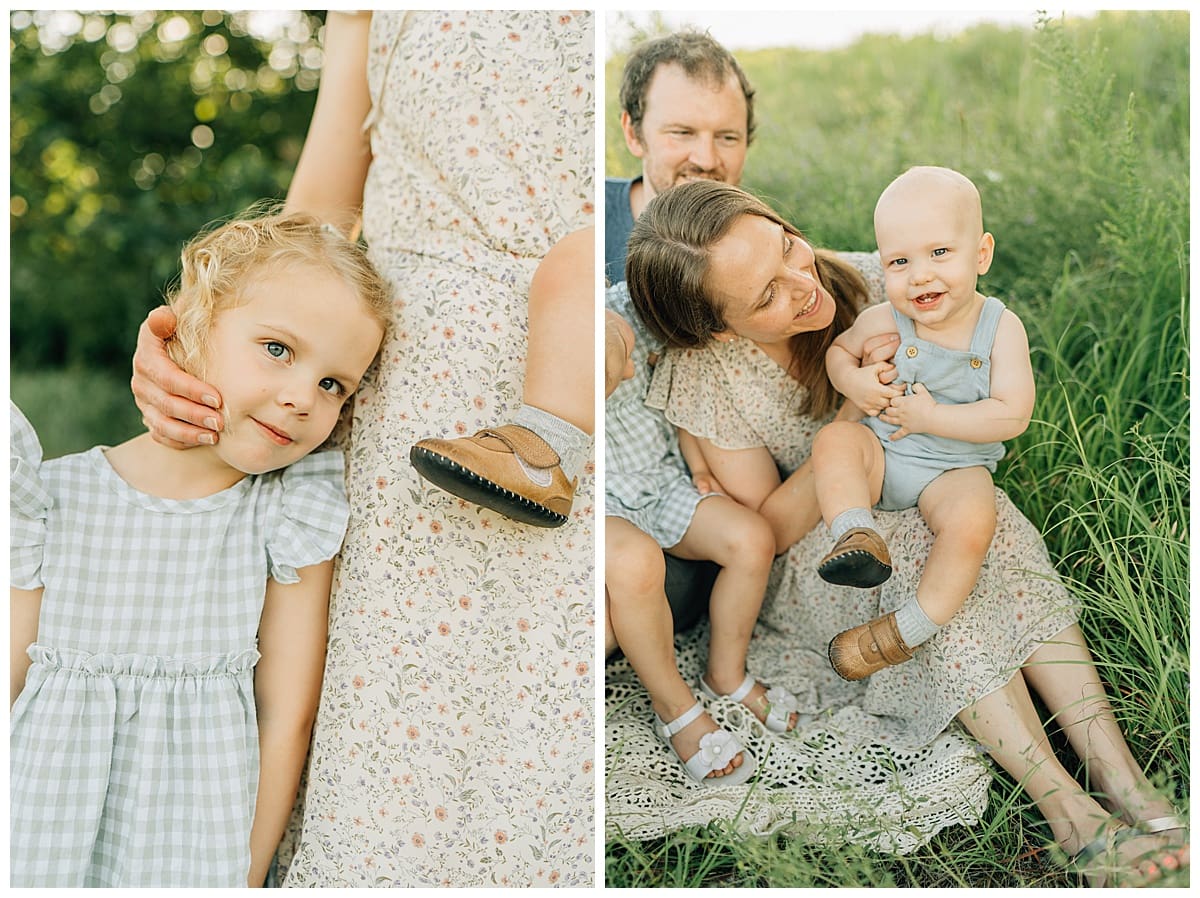 Soft outdoor portraits of a young girl leaning against her mother and a smiling baby sitting on mom’s lap in grassy field.